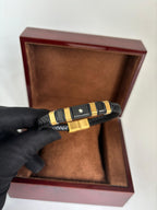 Pulseira Masculina Montblanc Premium – Aço Dourado e Trançado Preto